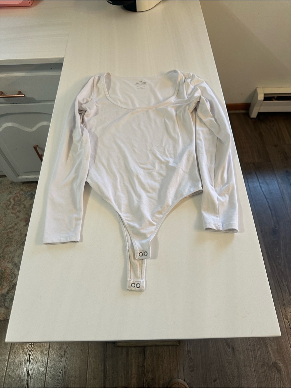 2 White Long-Sleeve Hollister body suit. One scoop neck and normal neck